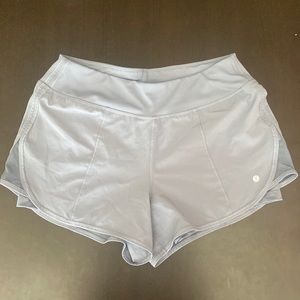 Athletic shorts with spandex inside. Size small in light blue.